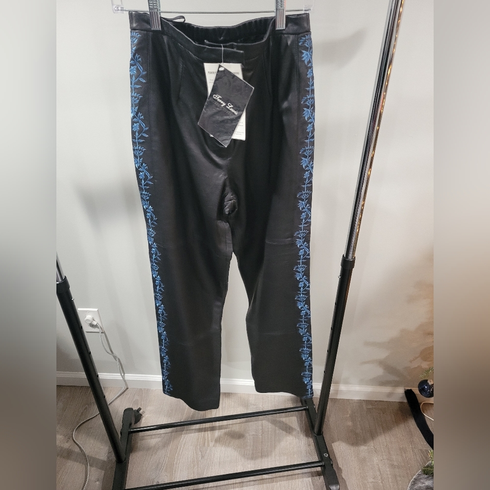 Black leather pants trimmed with blue floral embroidery,  size 10